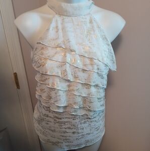 B. Wear party wear gold shimmery white party top